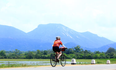 A tourist lady experiencing their cycling tour in Sri Lanka