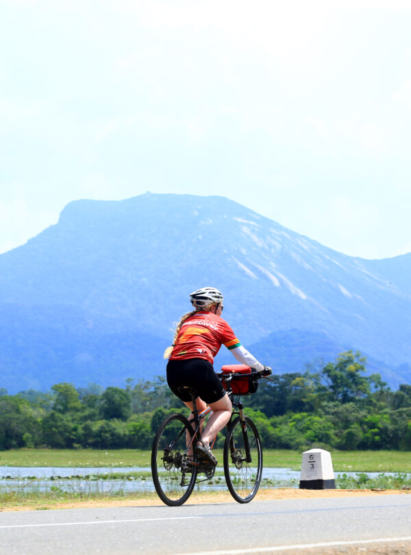 A tourist lady experiencing their cycling tour in Sri Lanka