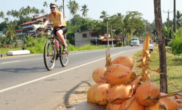 A lady experiencing their cycling tour at Kalthota in Sri Lanka